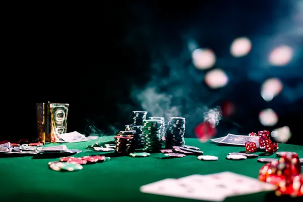 A close-up shot of golden coins falling around a spinning roulette wheel, representing immersive casino action at 9777BED.